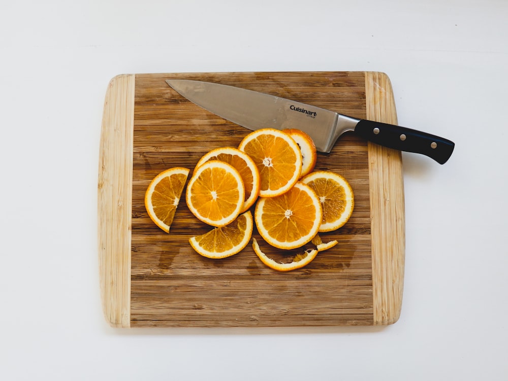 sliced oranges on chopping board