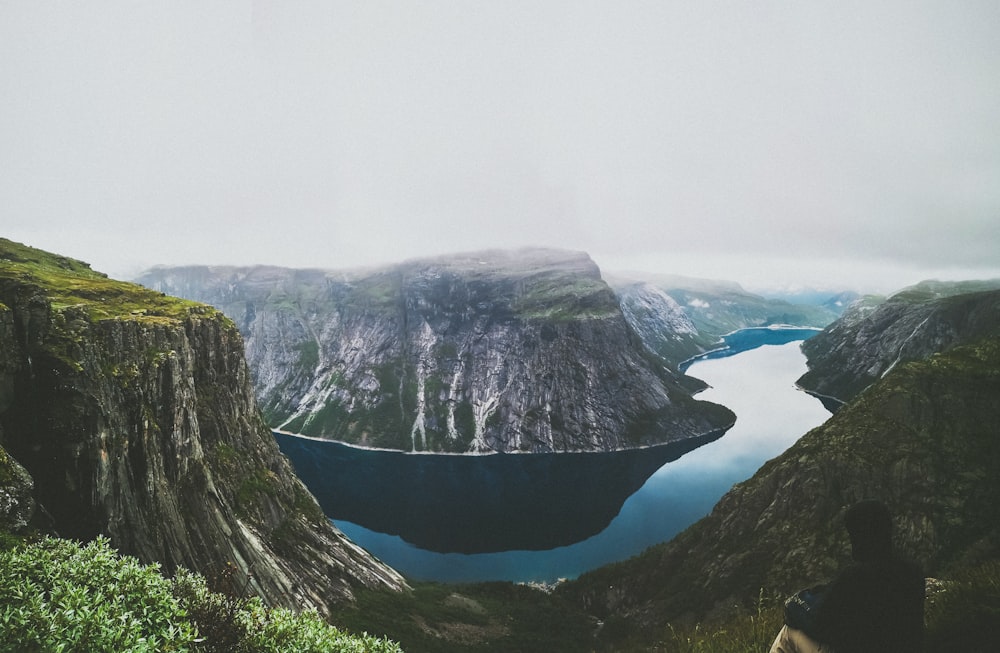 aerial photography of river and mountain during daytime