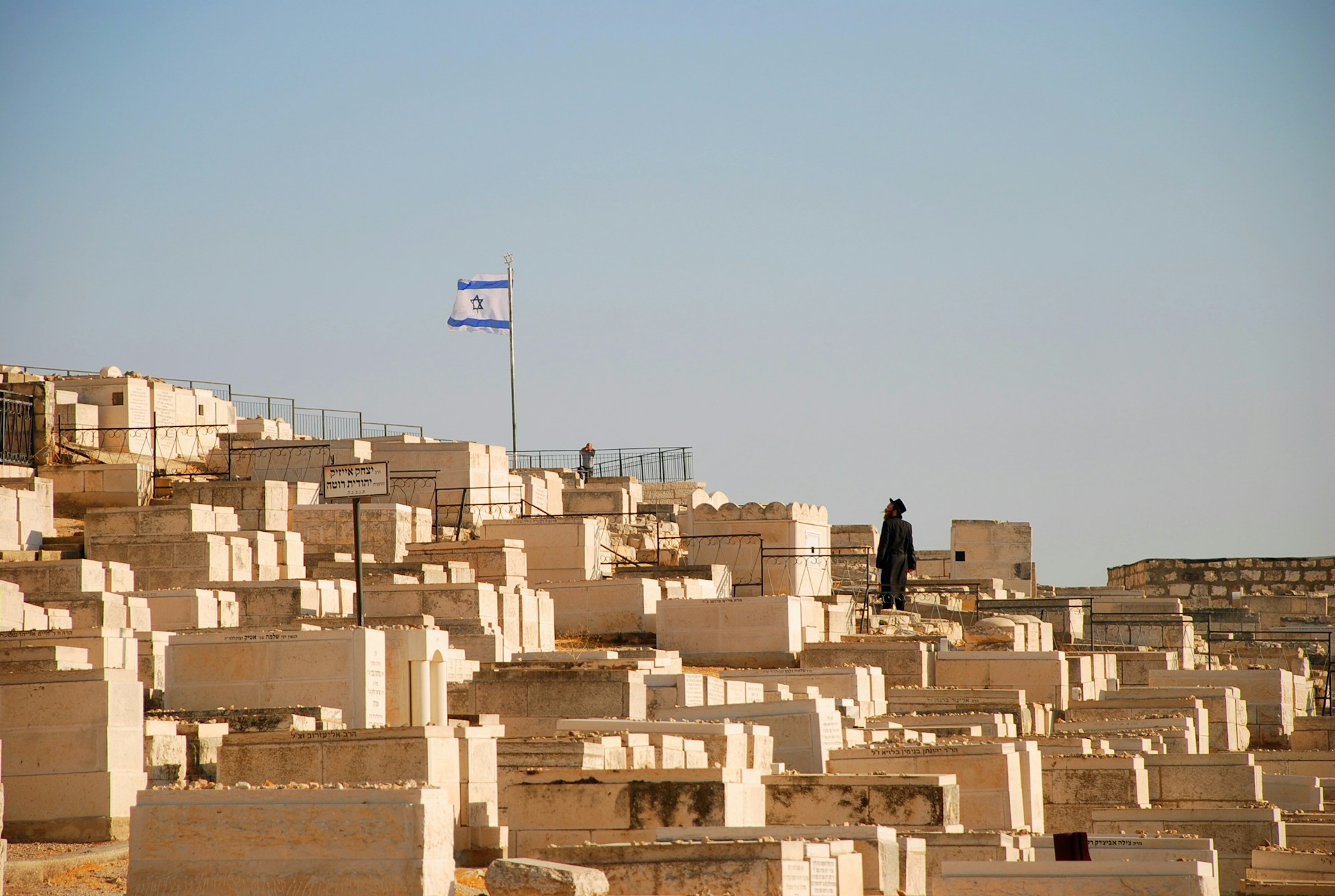 man standing on graveyard