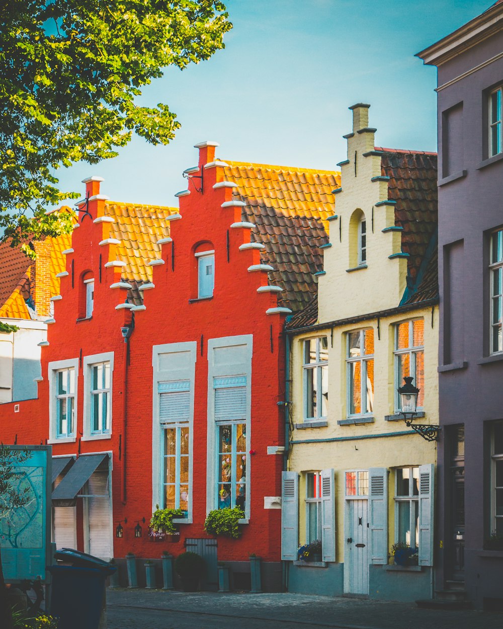 red and white concrete houses during daytoime