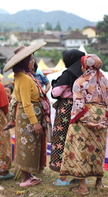 A group of Venezuelan women engaging in a community leadership workshop outdoors.