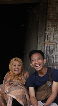 Seniors and youth sharing stories during a cultural event.