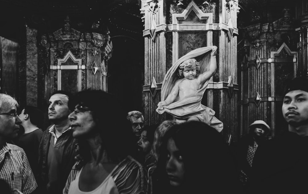 people beside statue