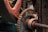 Close-up view of a rusty mechanical gear system with a chain and bolted components, showing signs of wear and age.