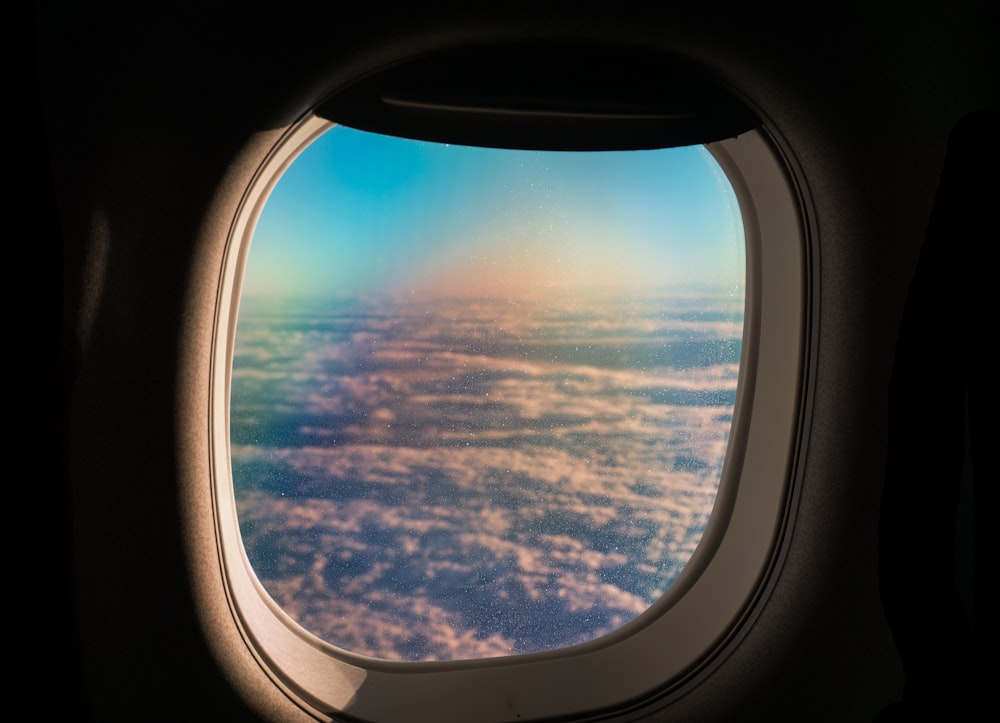 sea of clouds through airplane window