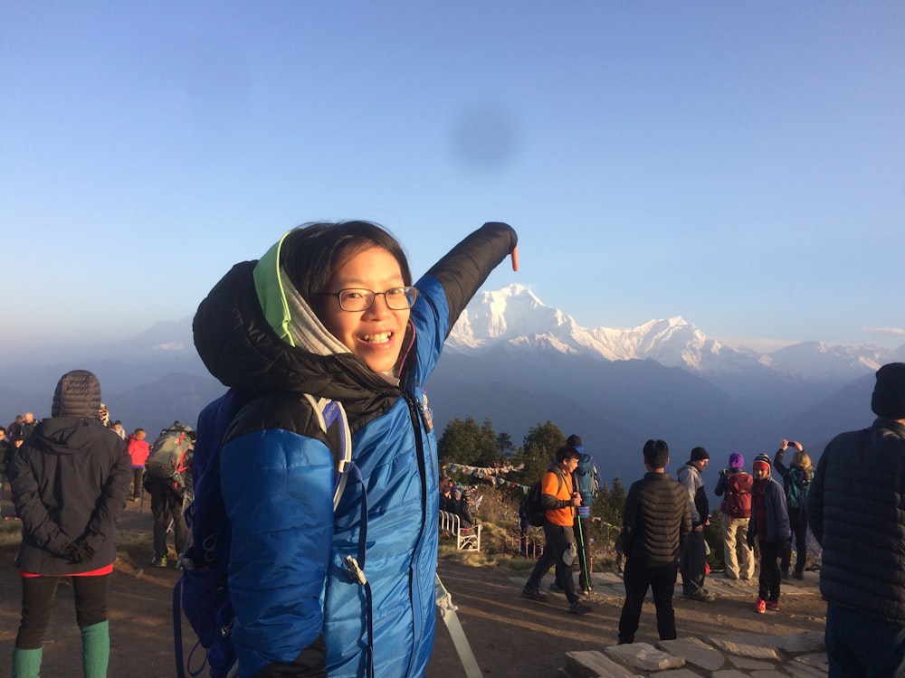 smiling man pointing mountain