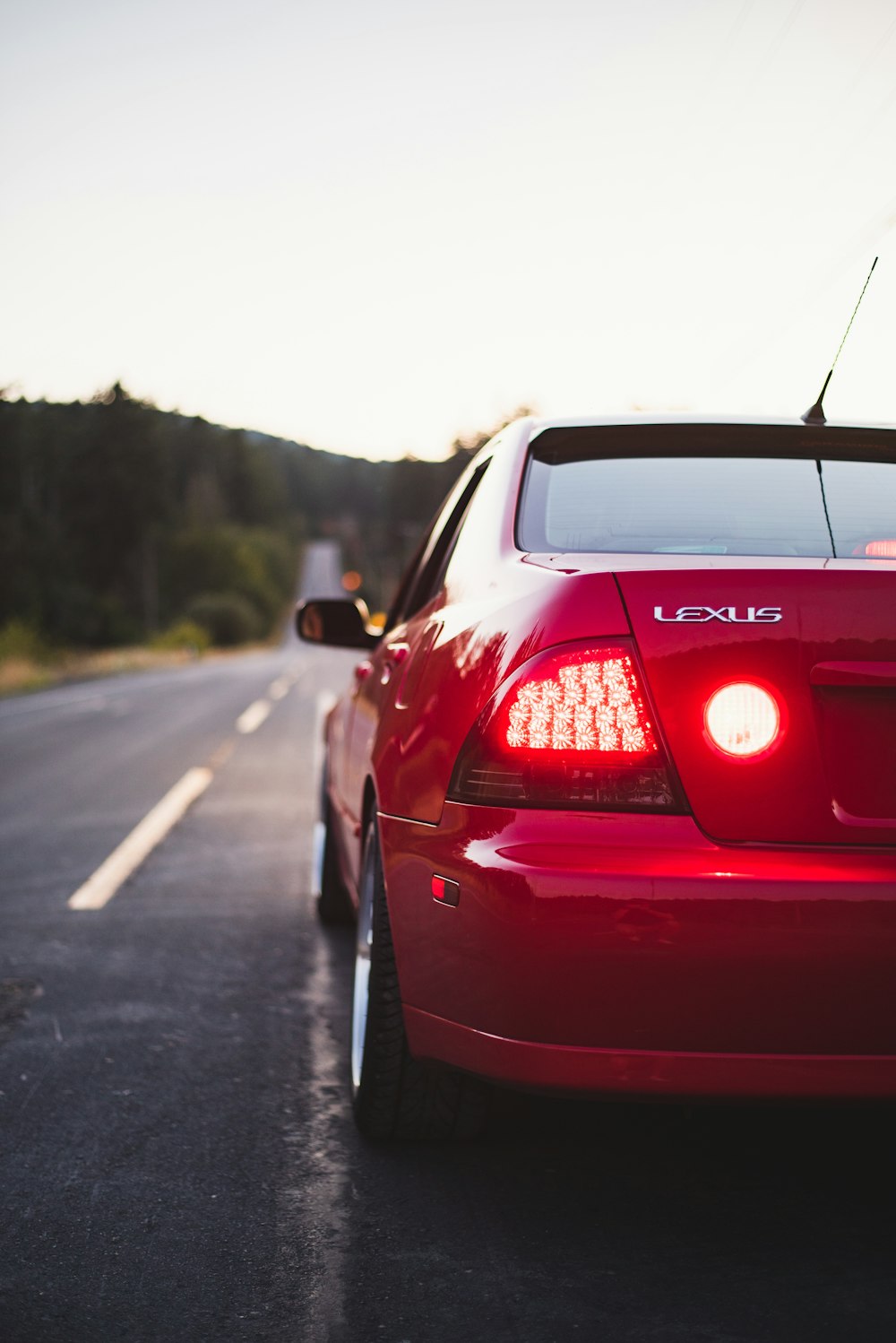 a red car parked on the side of the road