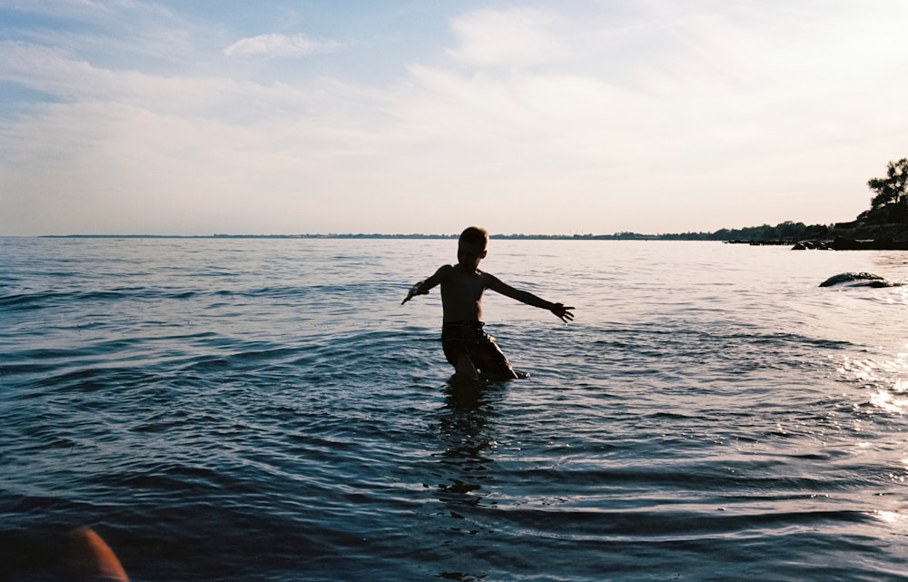 boy on body of water