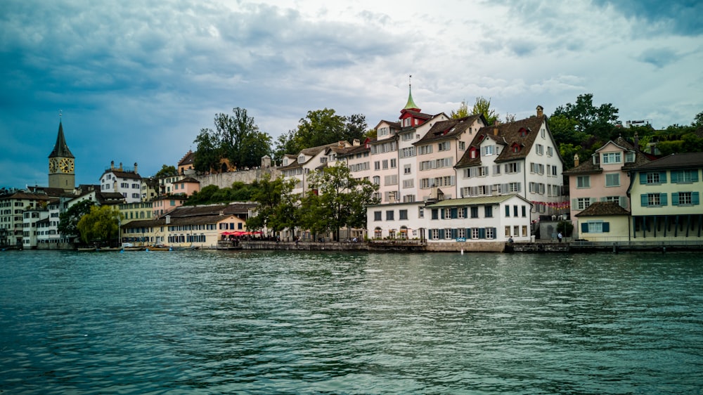 white houses near body of water