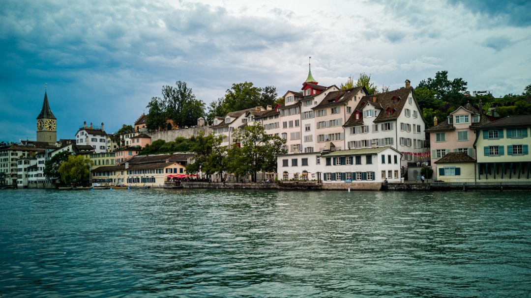 white houses near body of water,