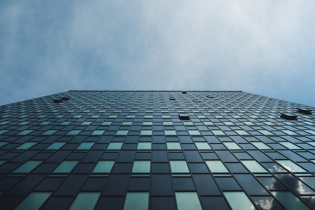 low angle photo of curtain glass wall building