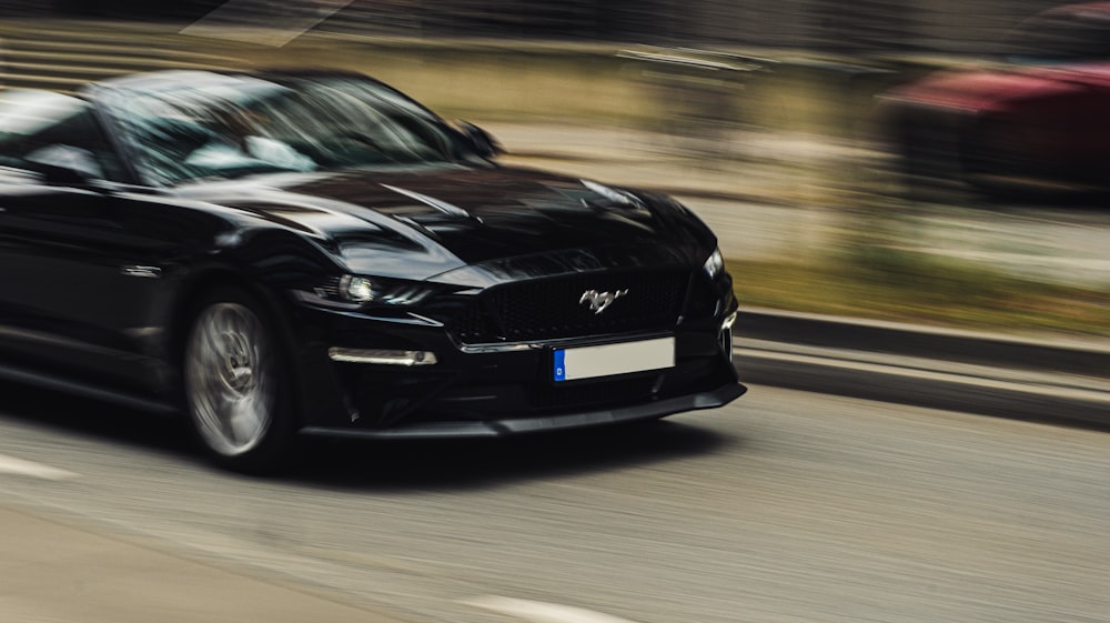 Ford Mustang running on road