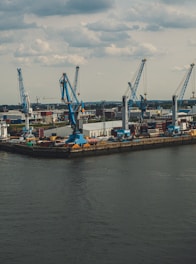 blue metal cranes at a dock