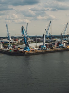 blue metal cranes at a dock