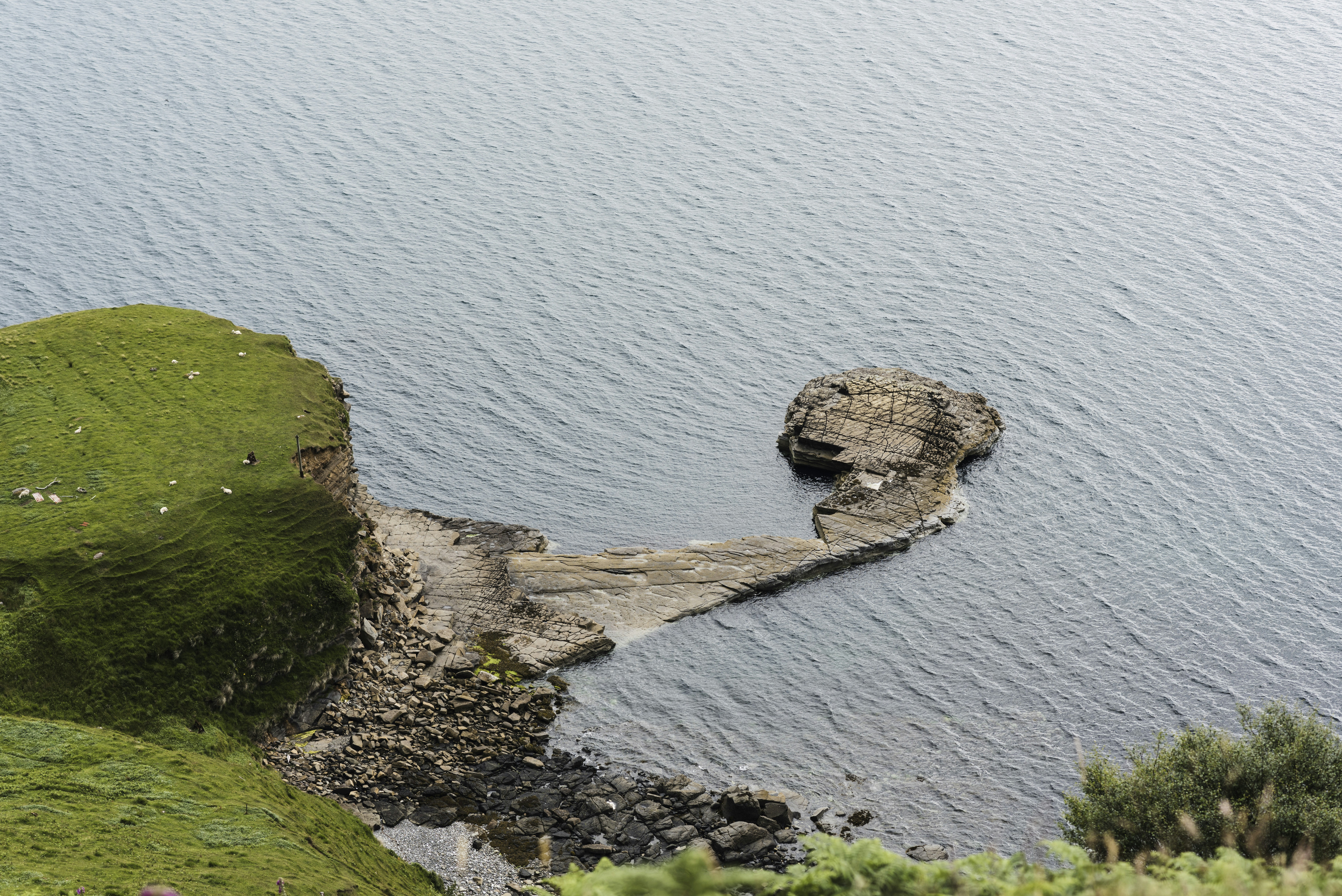 body of water with green hills