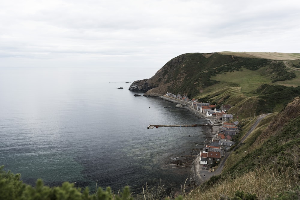 several houses at the shore below the cliff