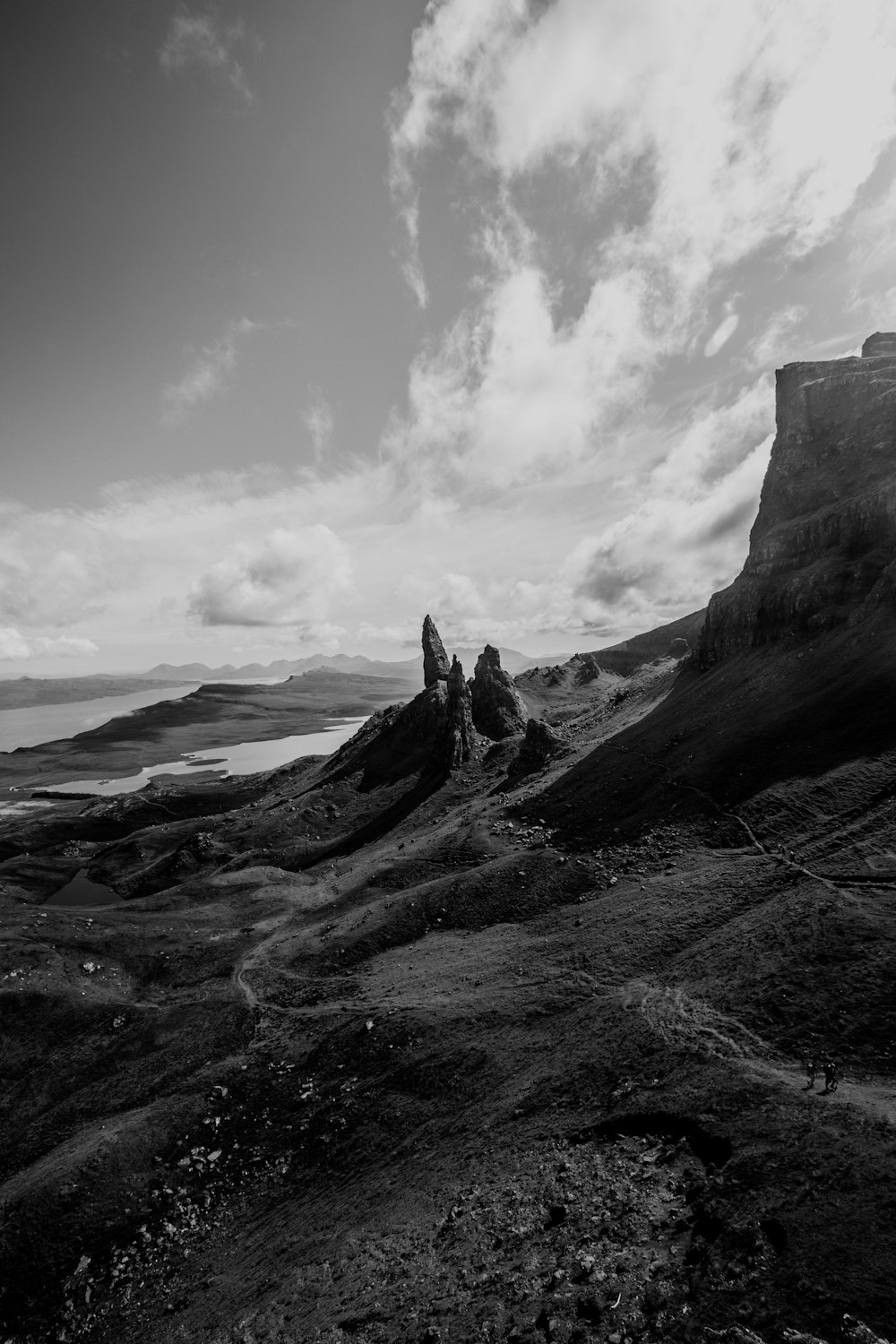 a black and white photo of some rocks and water