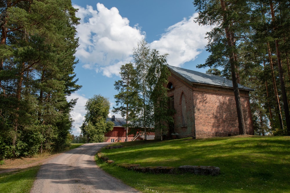 house beside dirt road during daytime