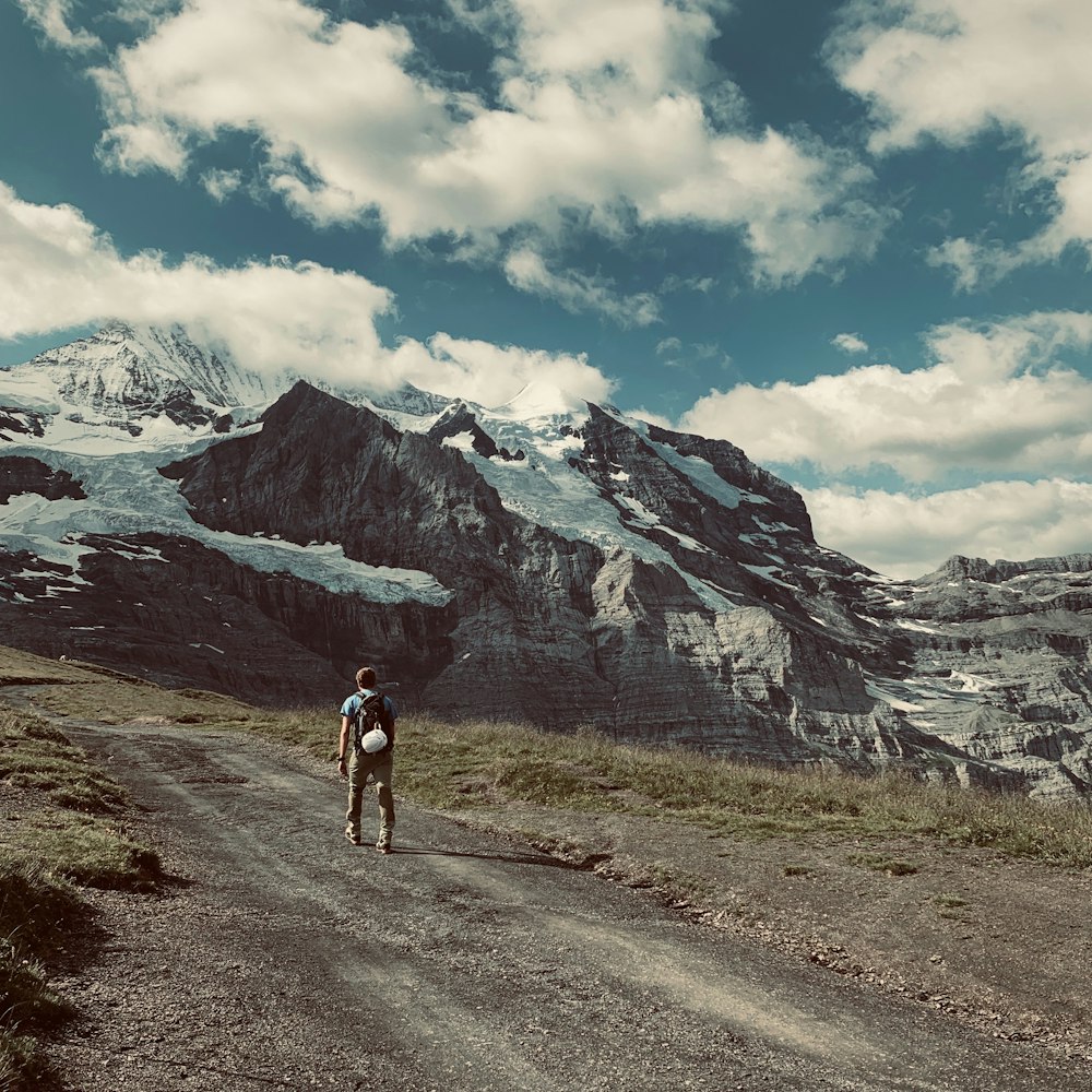 man walking on pathway