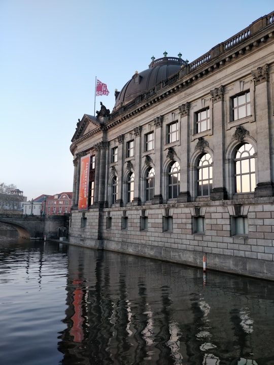 grey concrete building near body of water during daytime in Bode Museum Germany