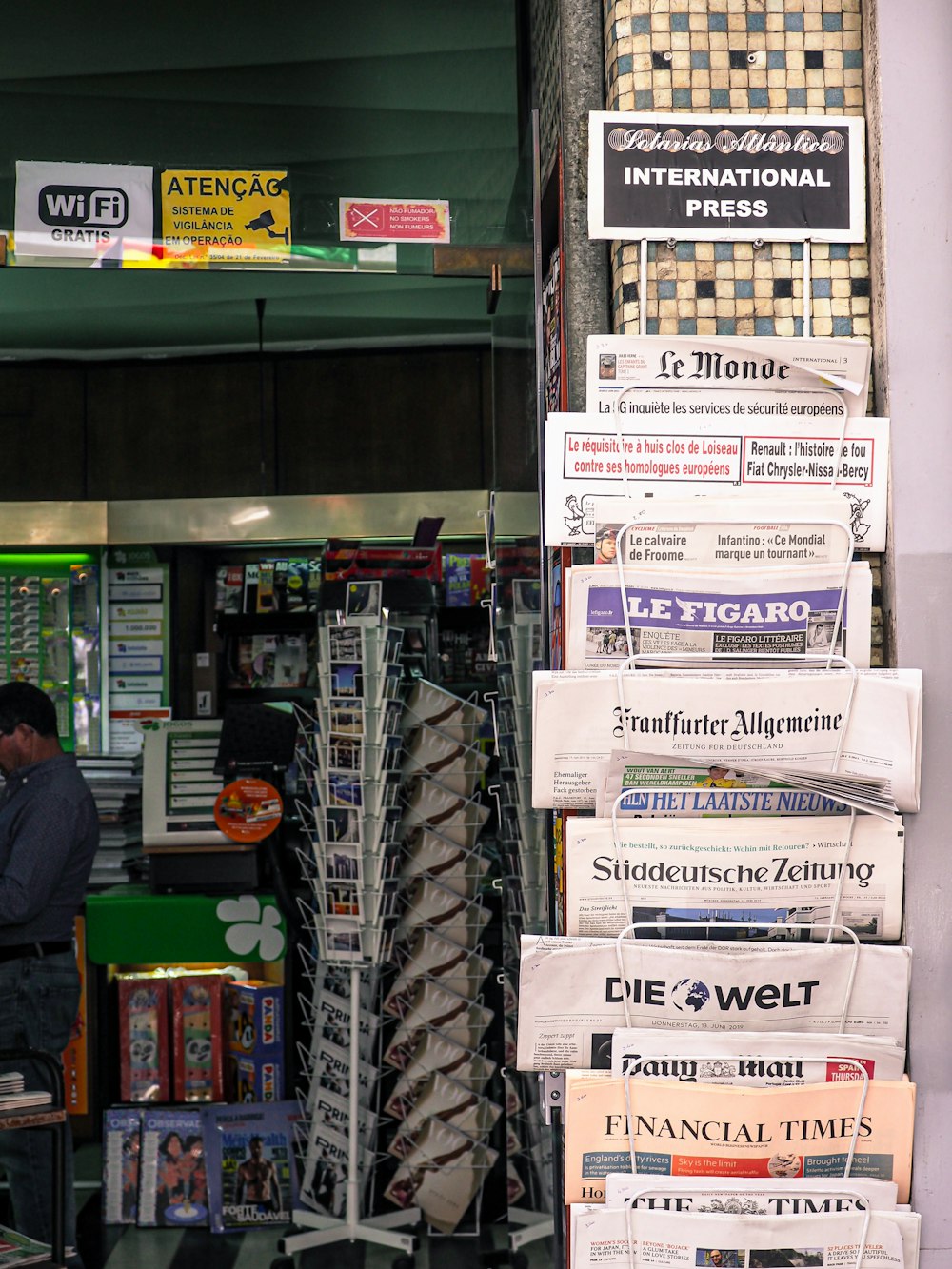 a man is standing in front of a store