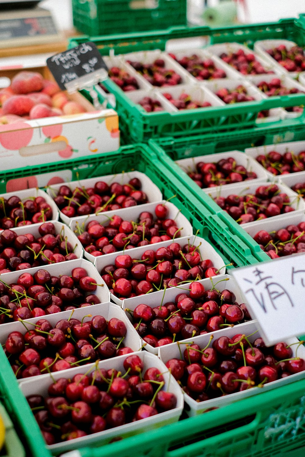 baskets of cherries for sale at a market