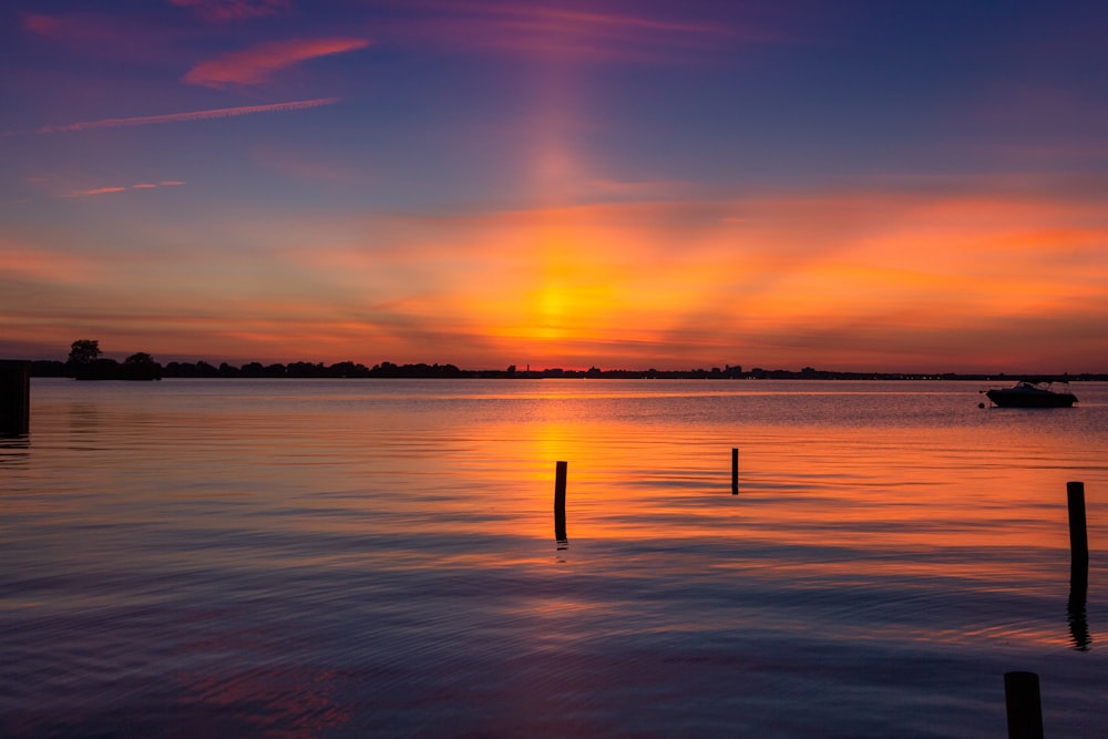 blue sea under orange sky