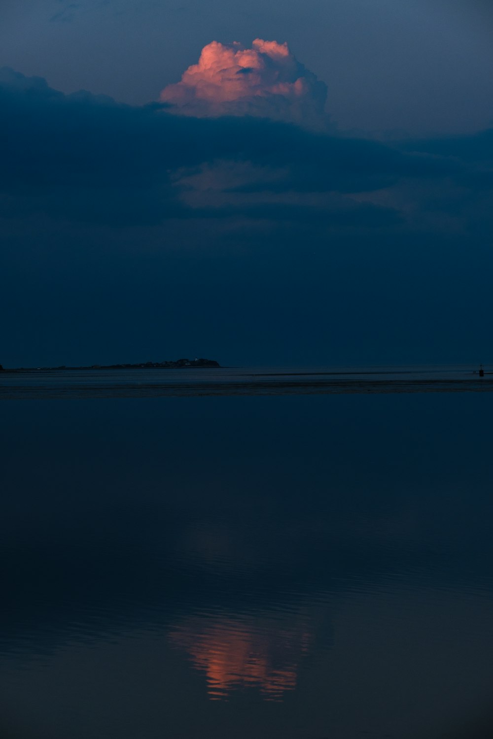 blue calm sea under blue skies