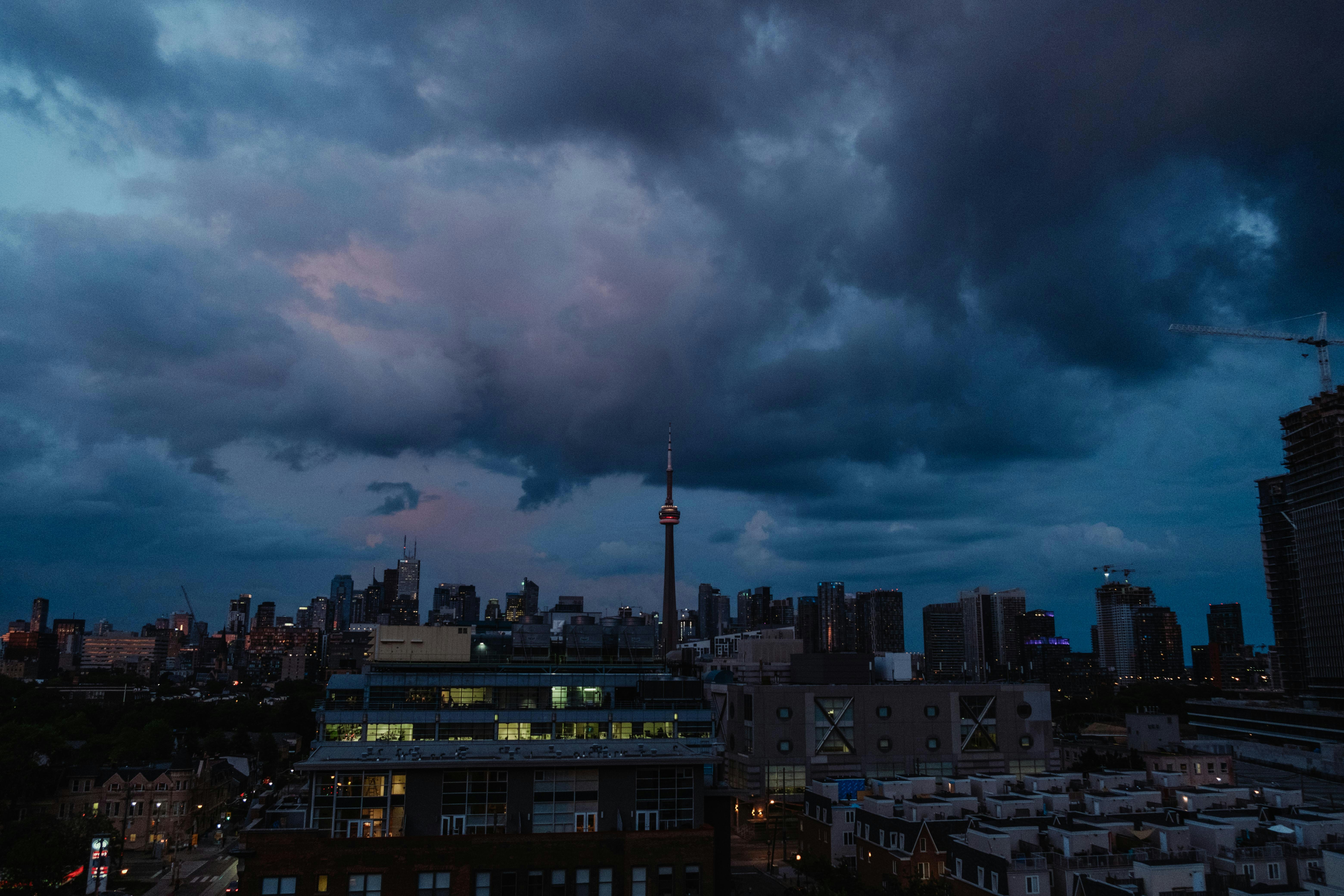 high-rise buildings under cloudy sky