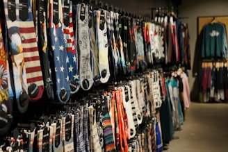 assorted clothes hung on display racks