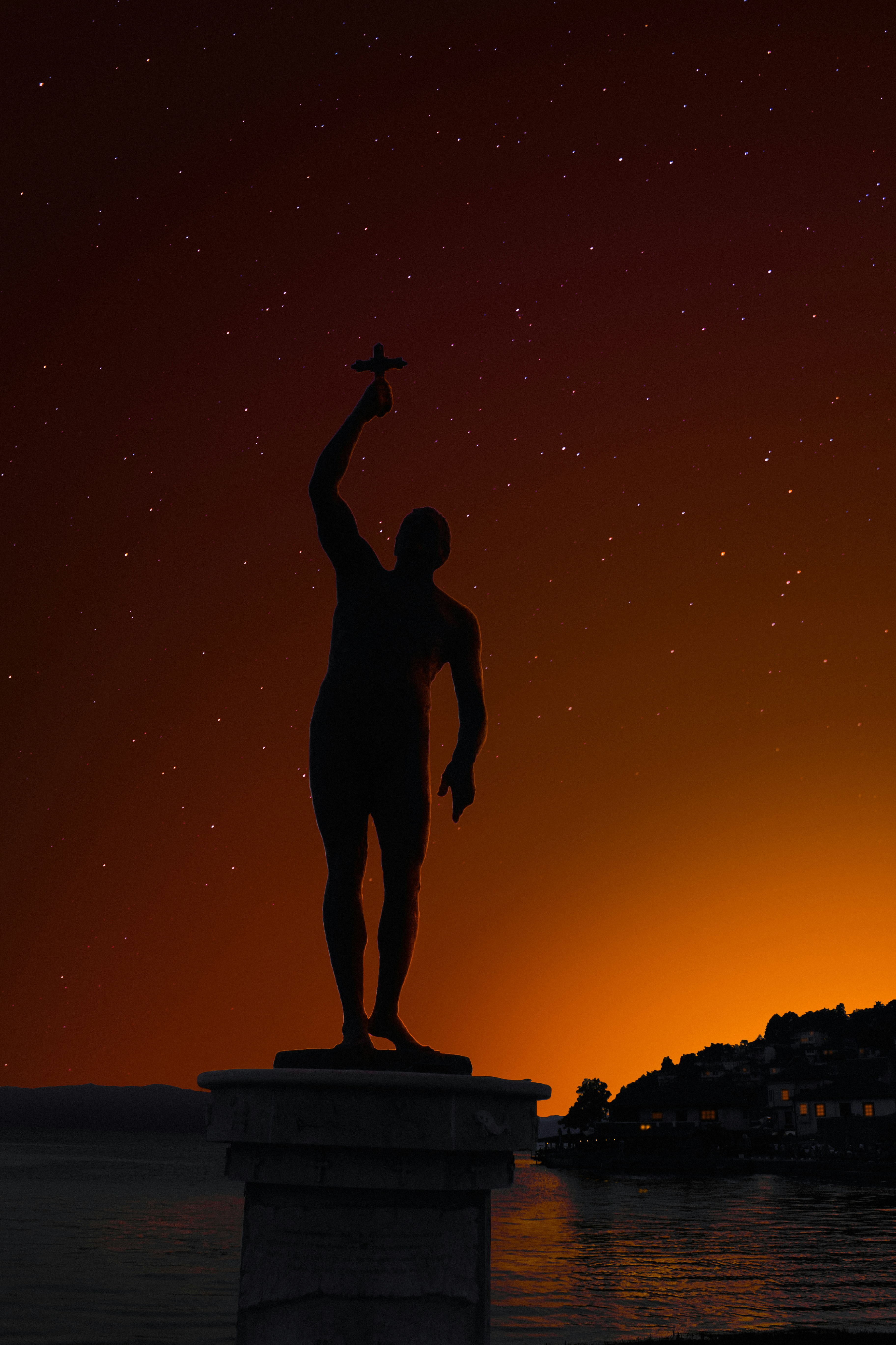 statue near body of water photo Free Brown Image on Unsplash