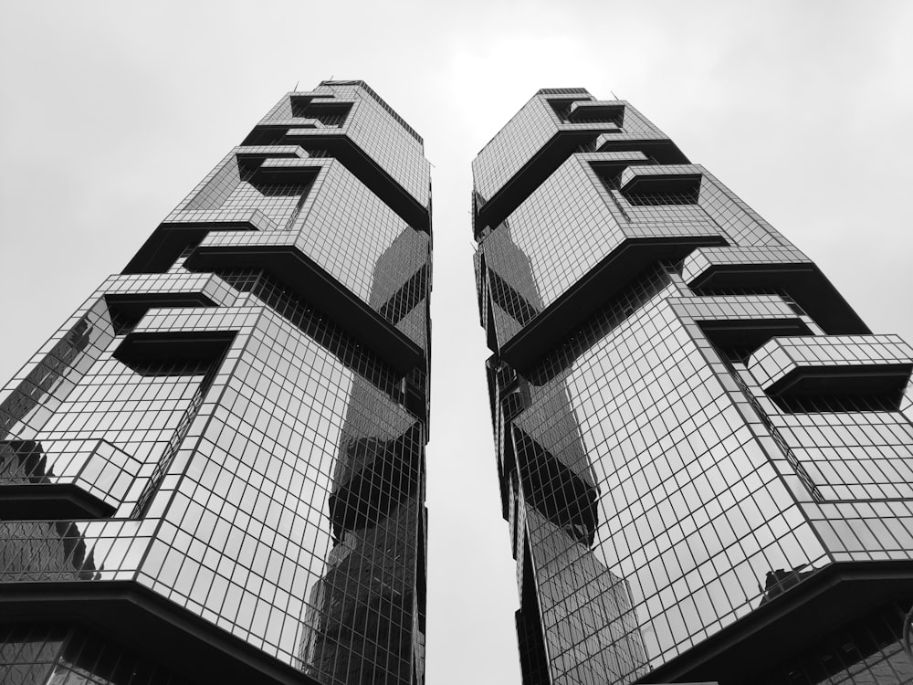 grayscale photography of glass walled high-rise building