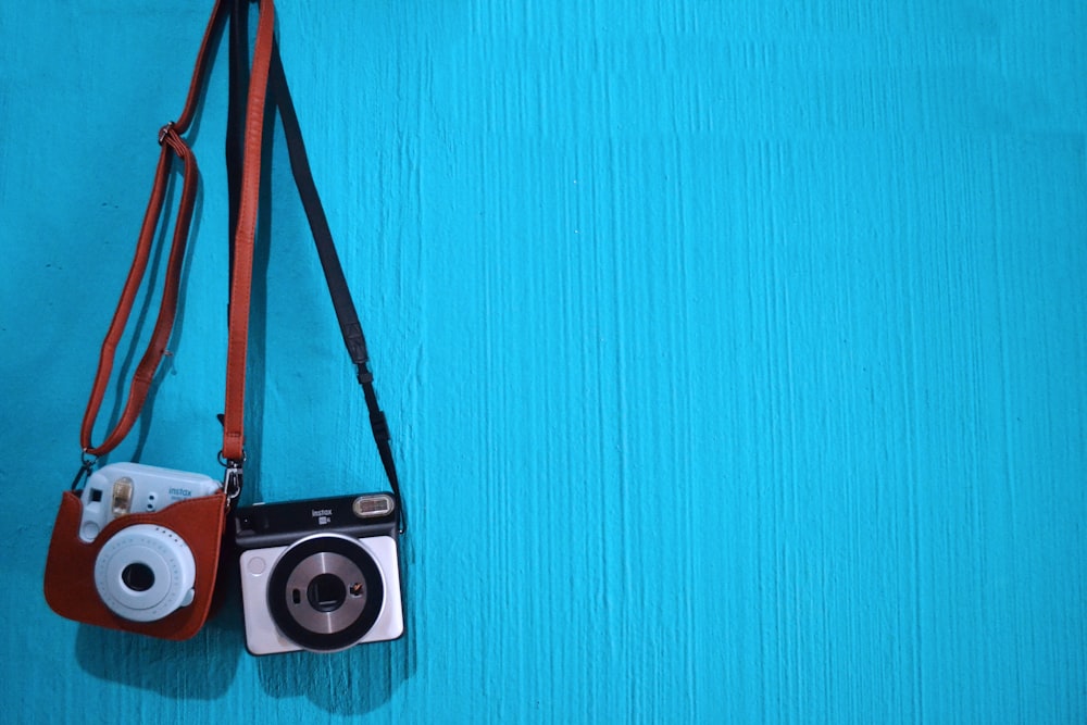 two brown and black cameras