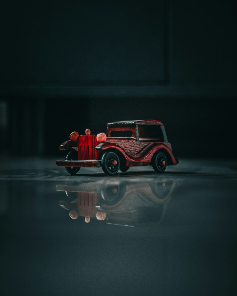 red and black vehicle scale model