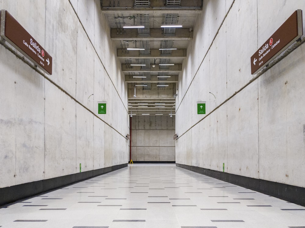 white concrete floor beside wall