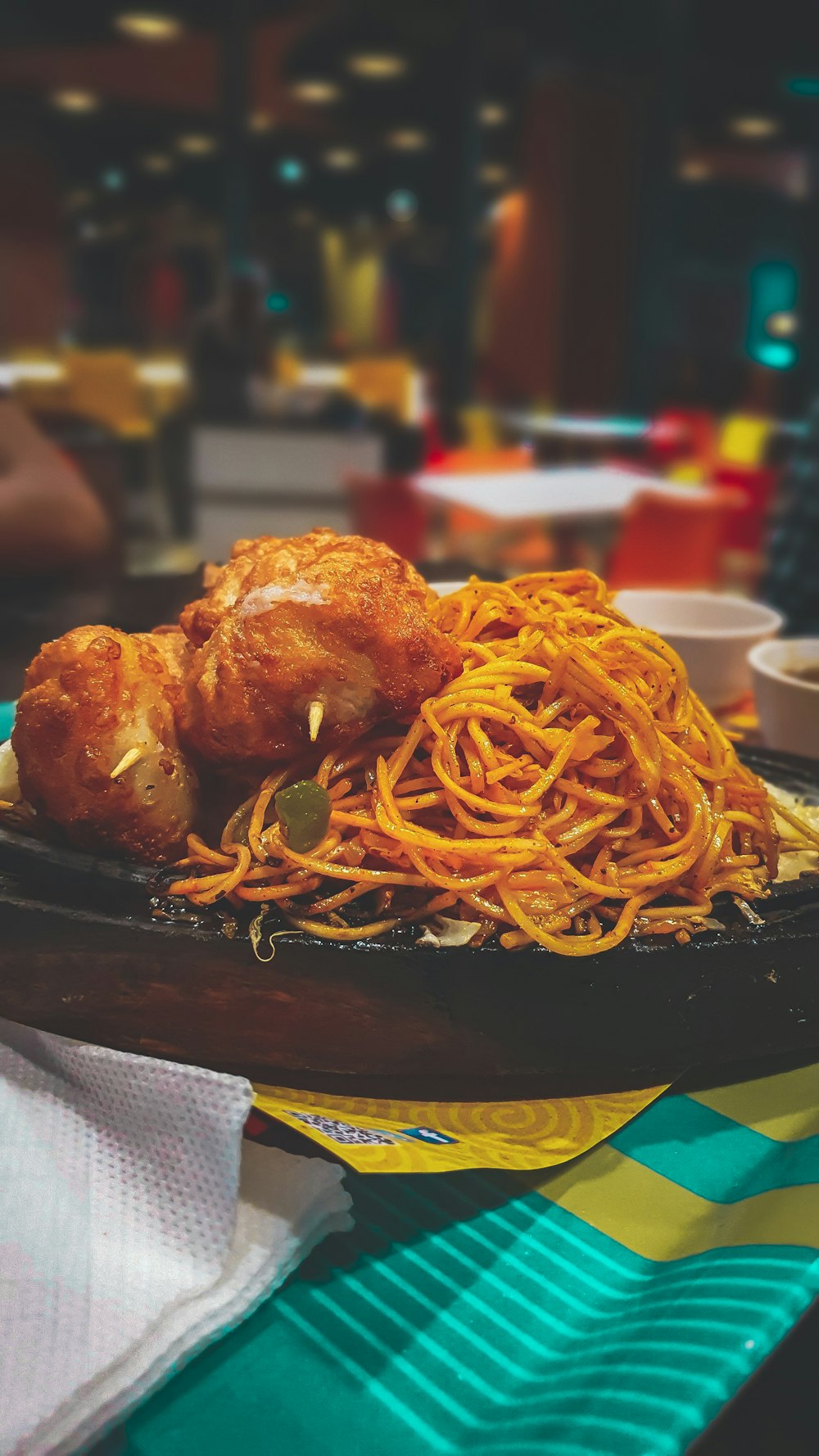 spaghetti and fried chicken platter on table
