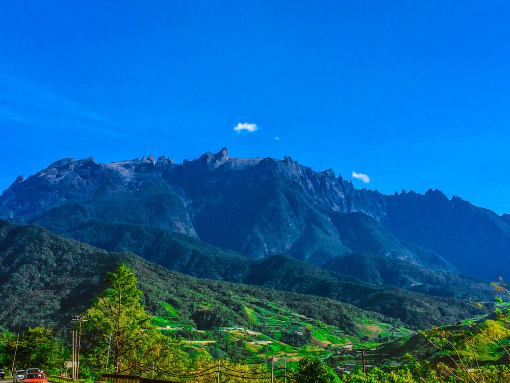 green mountain under clear blue sky during daytime