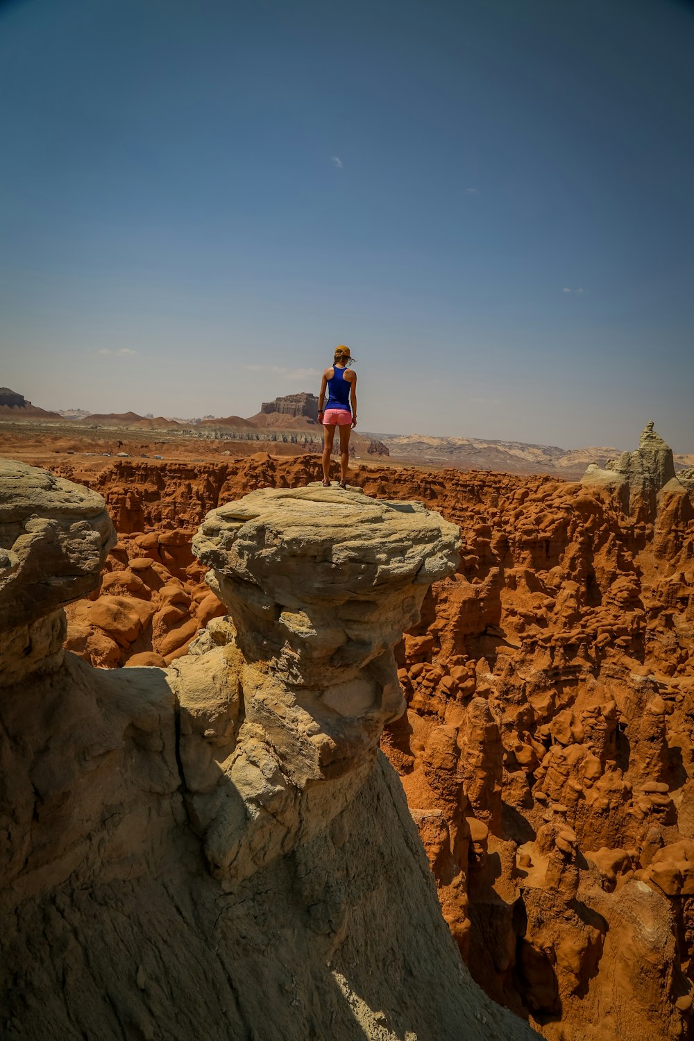 woman standing on rock formation