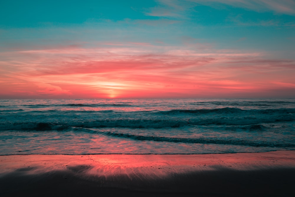 landscape photo of a beach at sunset