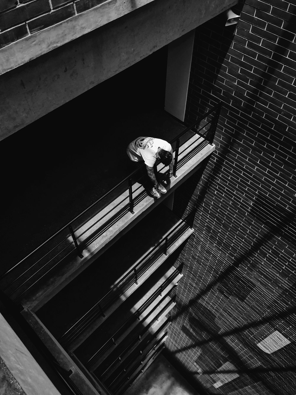 man leaning on railing