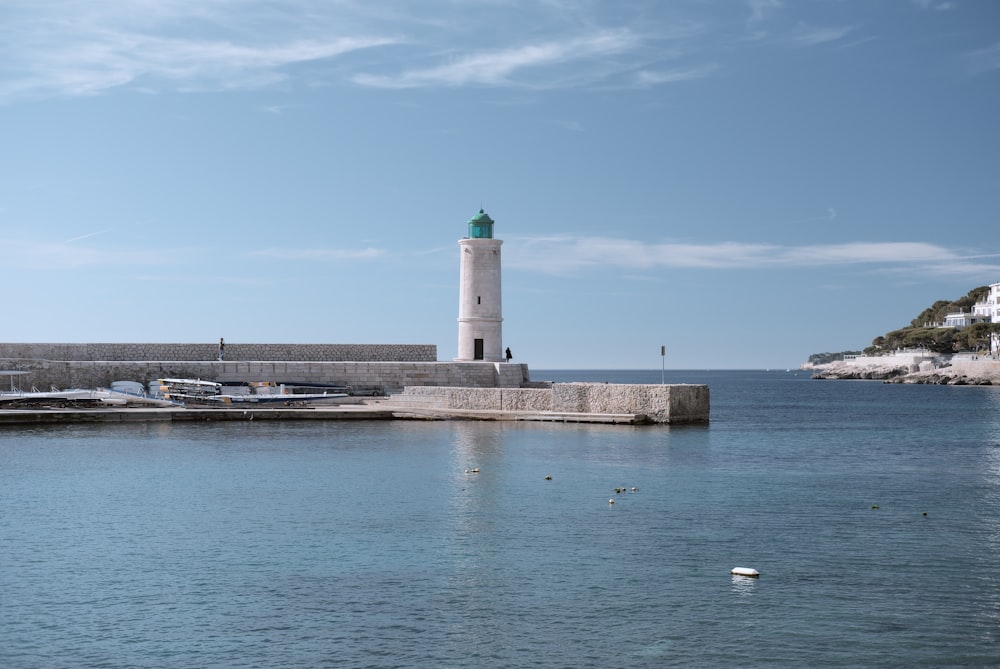 light house and body of water