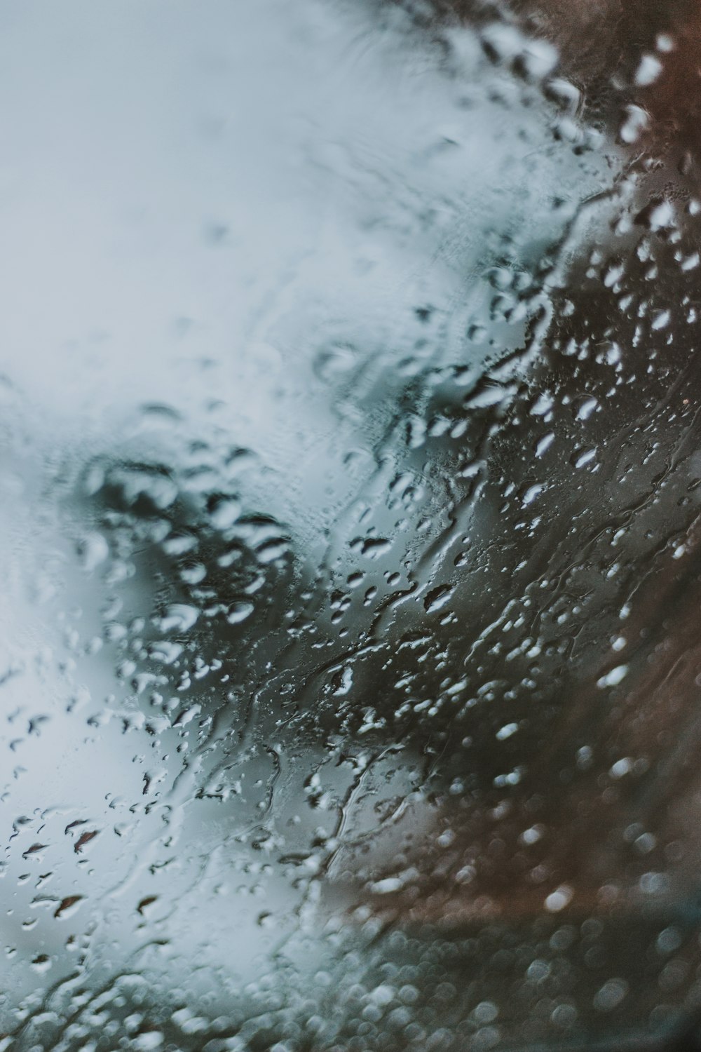 a close up of a window with rain drops