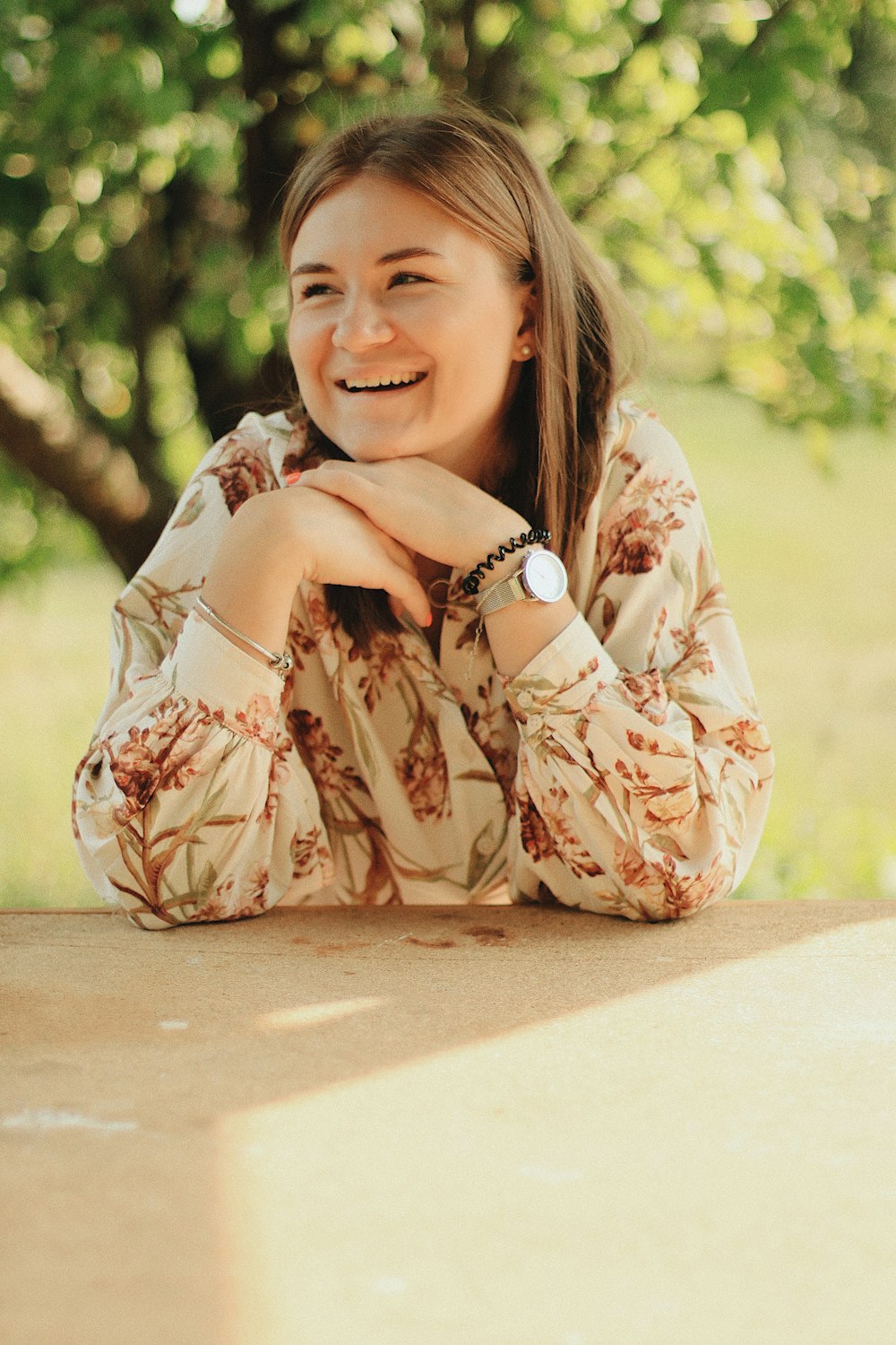 woman's beige and red floral print top