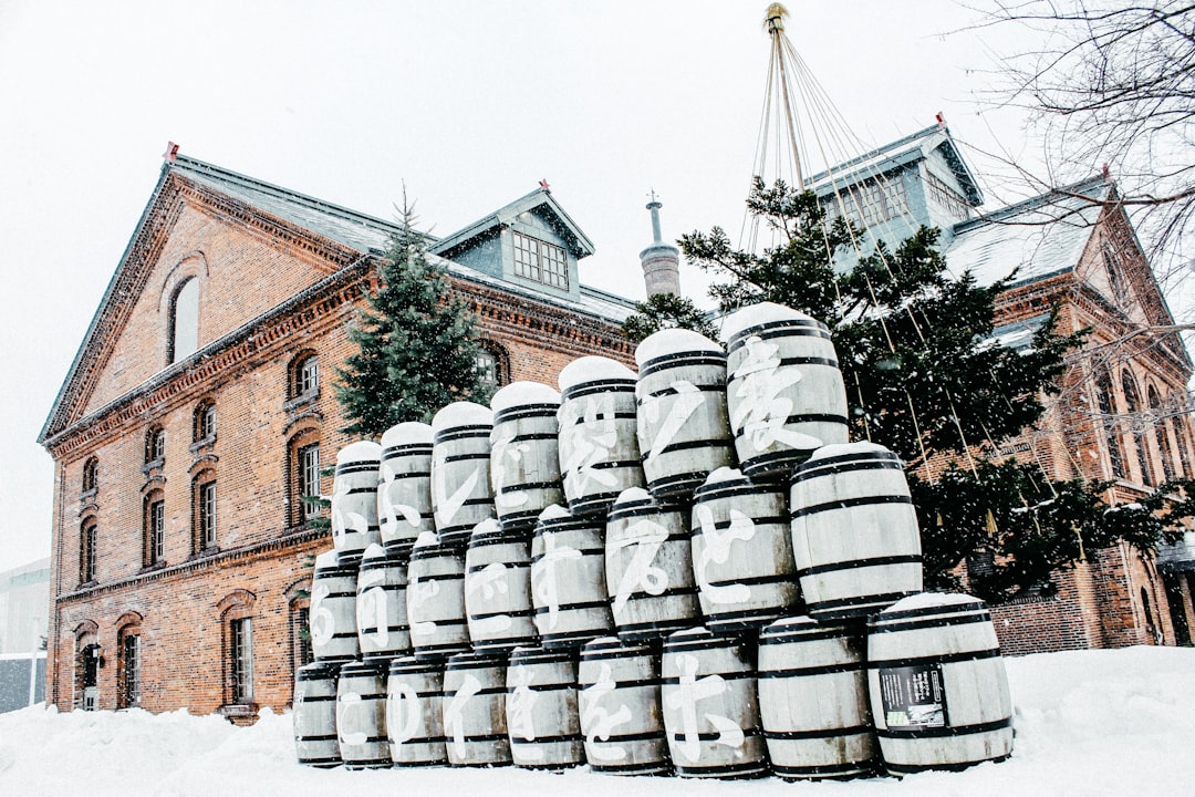 pile of barrels outside house