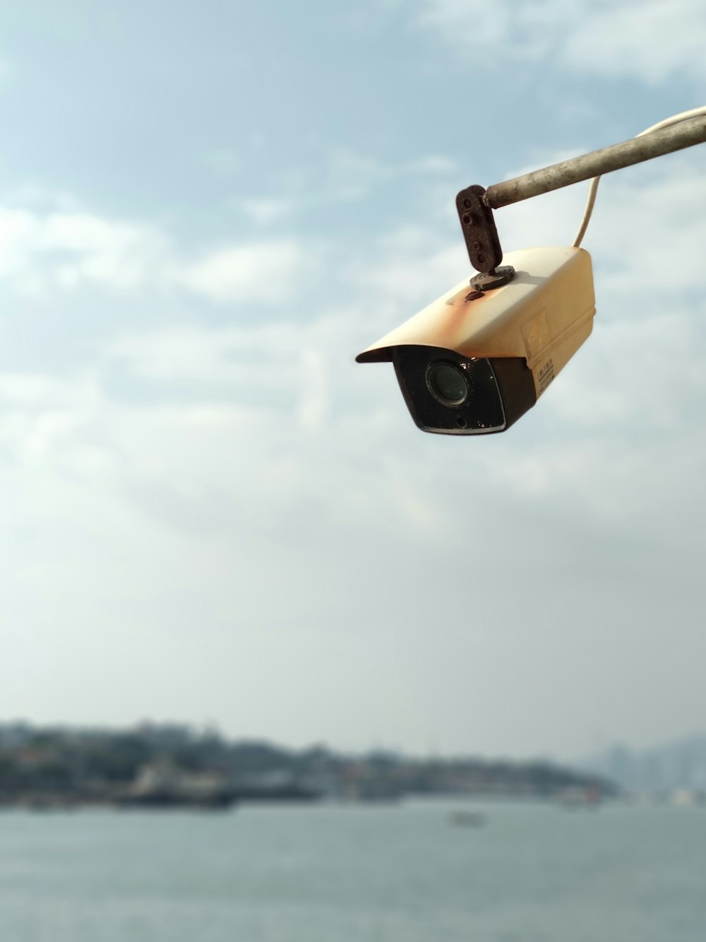 white surveillance camera looking down