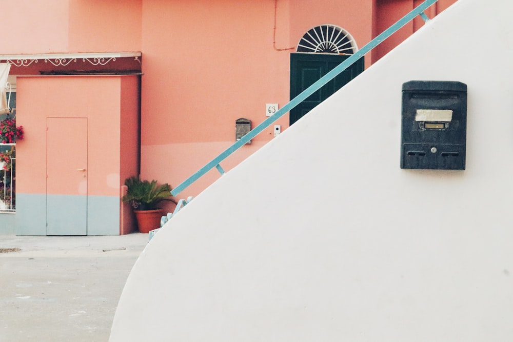 a parking meter on the side of a building