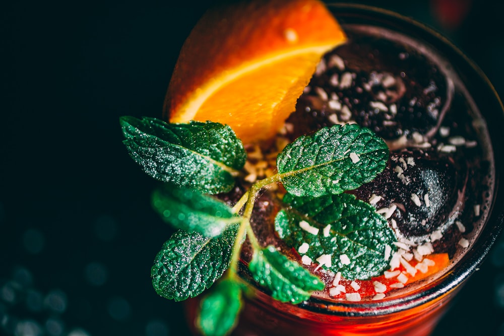 sliced orange on glass cup