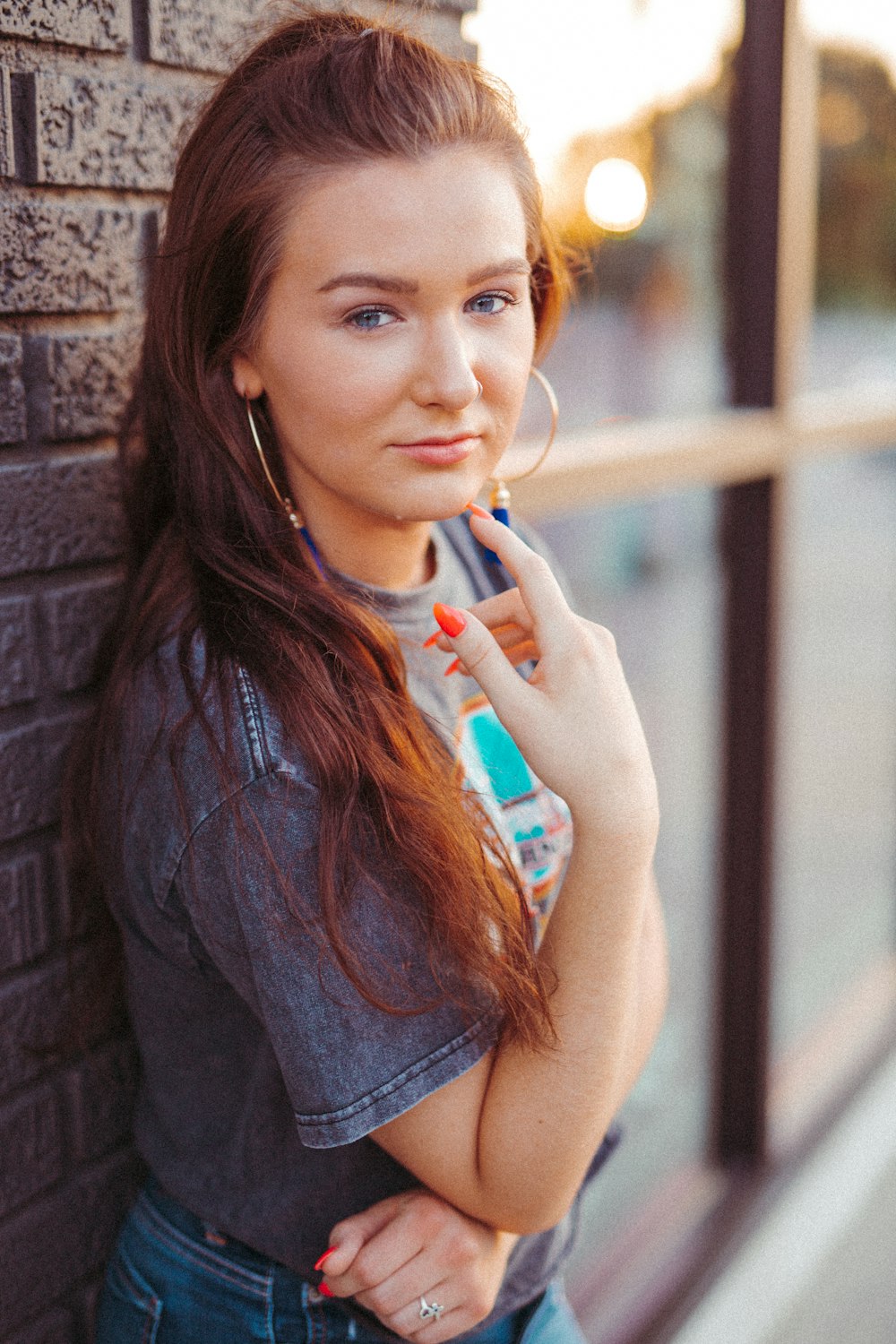 woman leaning beside wall