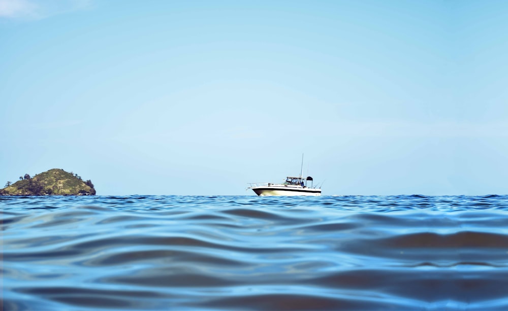 white boat and body of water