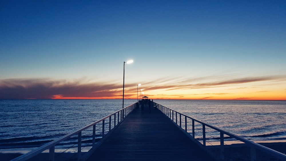 wooden dock during golden hour